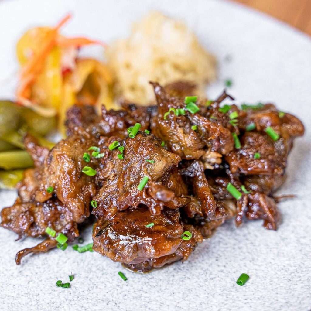 Vegetarian BBQ meat alternative with pickled vegetables and coleslaw