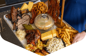 BBQ platter with ribs, brisket, fries and coleslaw