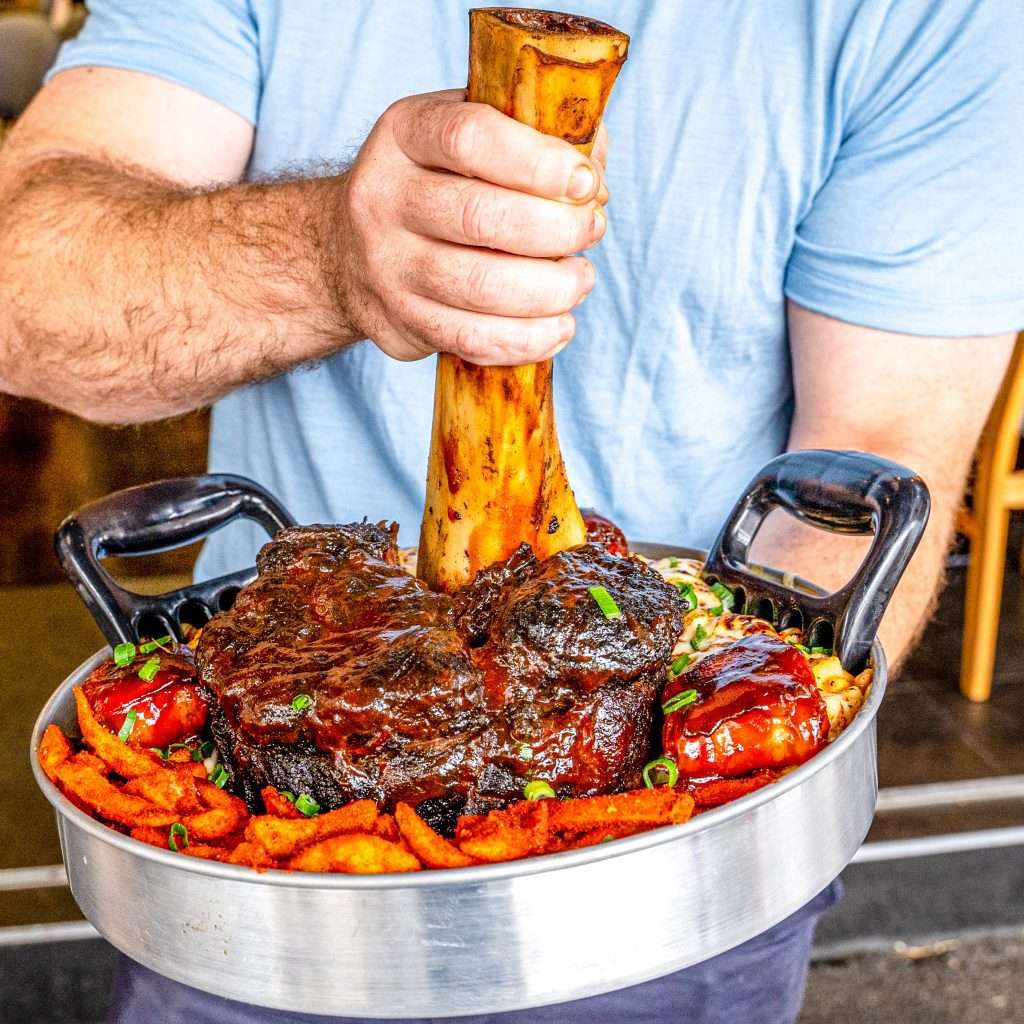 Thor's Hammer whole smoked beef shin lifted from a sharing pan of wedges
