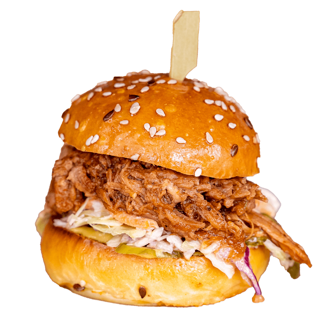Pulled pork slider with coleslaw on a sesame seed bun