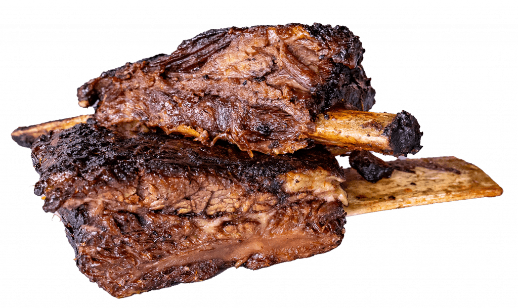 Smoked beef ribs with a dark bark crust