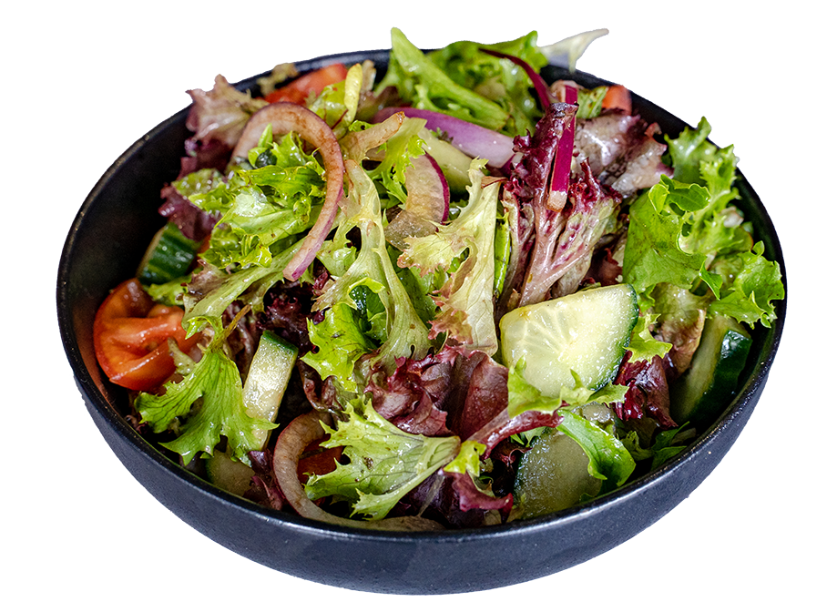 Bowl of mixed green salad with tomato, cucumber and red onion