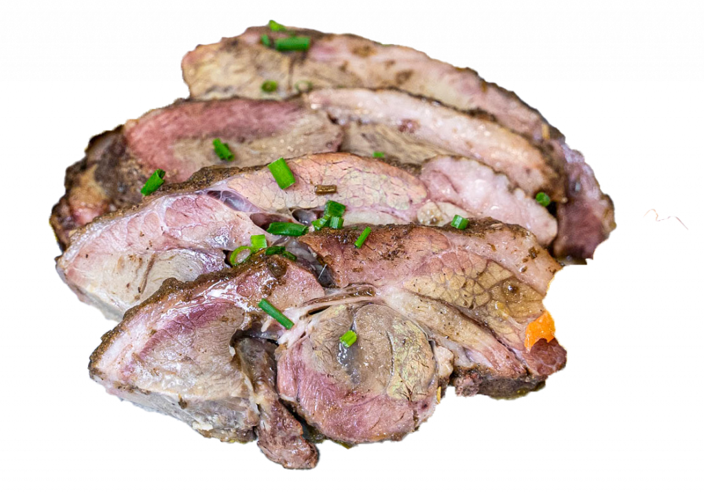 Sliced lamb shoulder garnished with chives