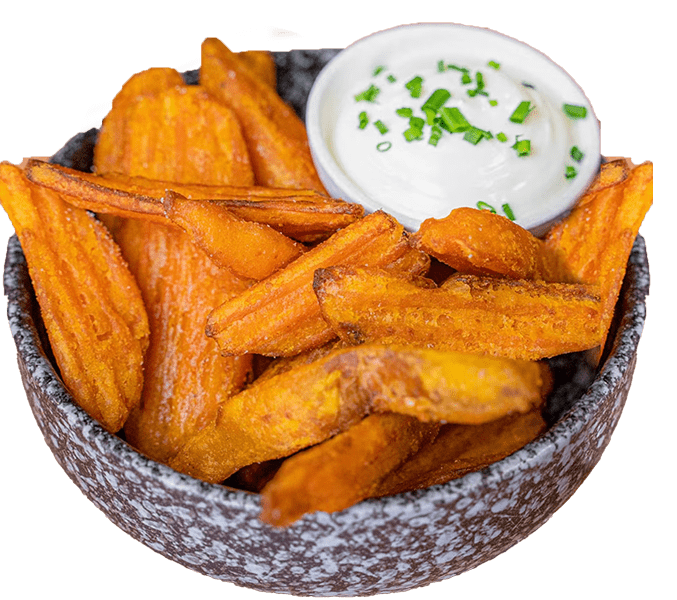 Bowl of sweet potato wedges with a herbed dip