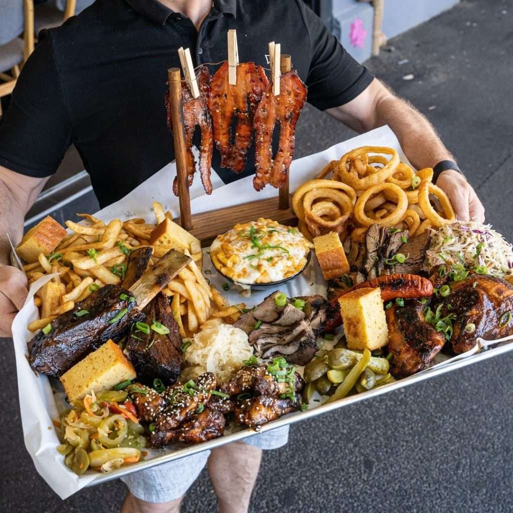 BBQ platter for 6 with ribs, brisket, fries and sides
