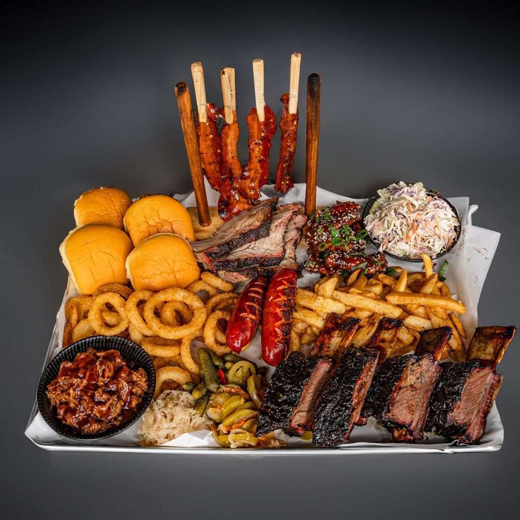 Platter for 4 with beef ribs, sliders, onion rings and fries
