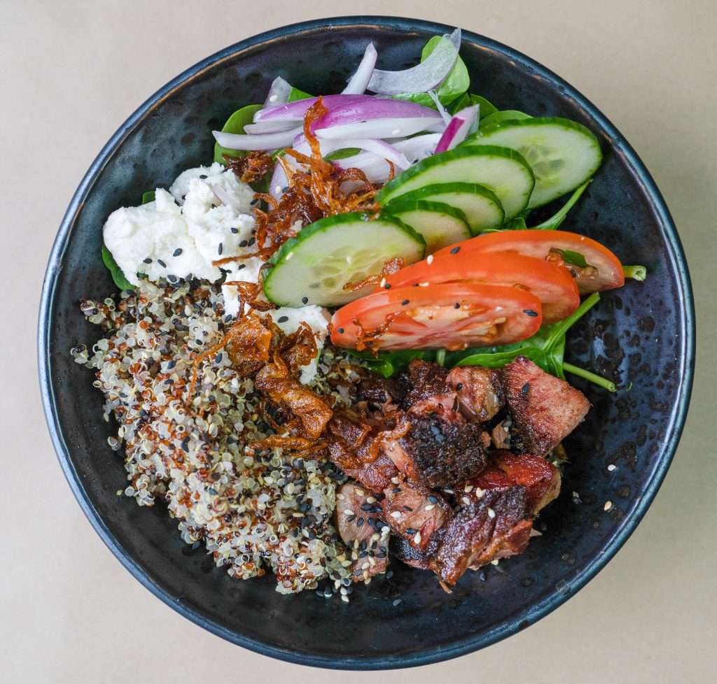 Greek-style Munch Bowl with grains, salad and grilled meat