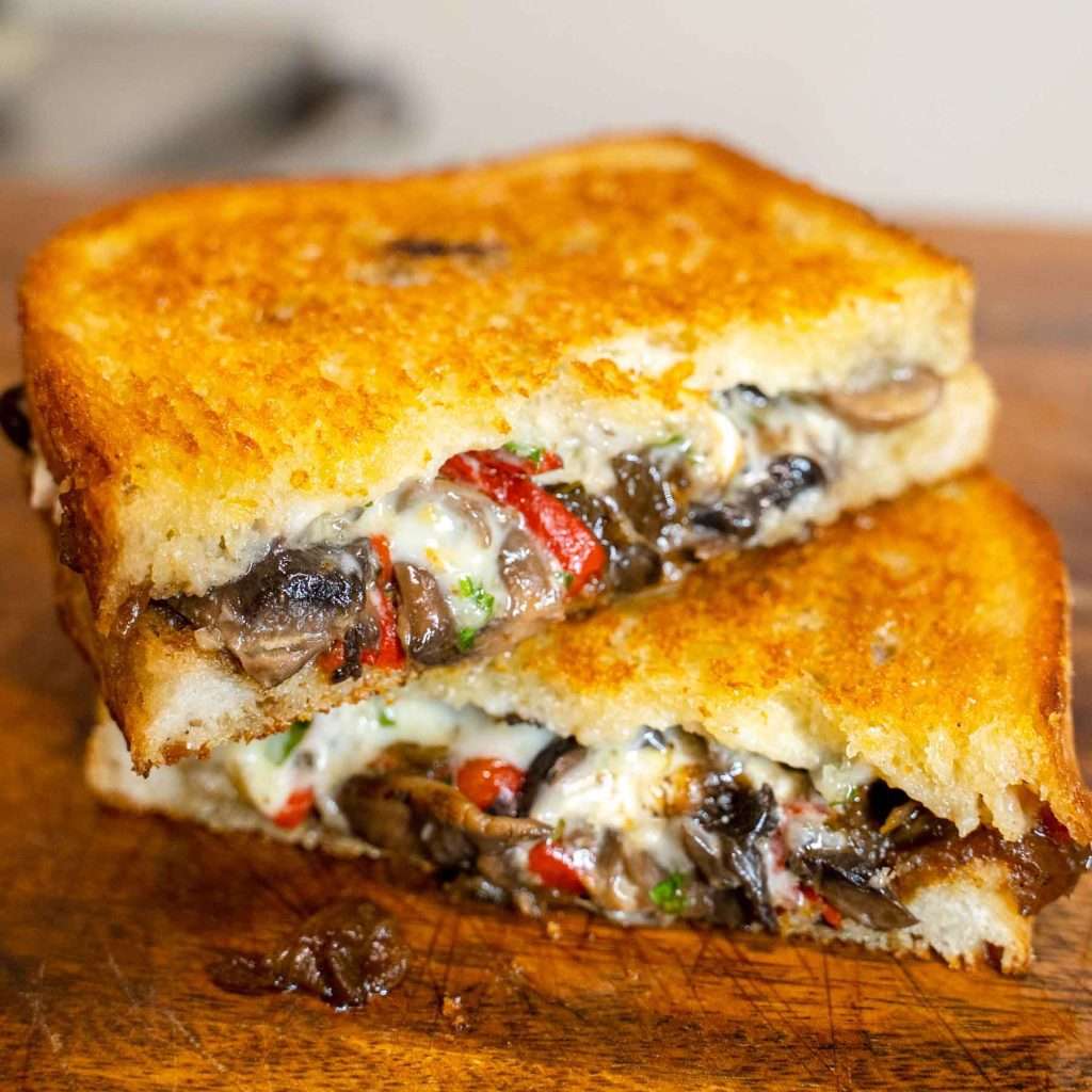 Roastie Goatie toastie with mushroom and capsicum filling, cut in half
