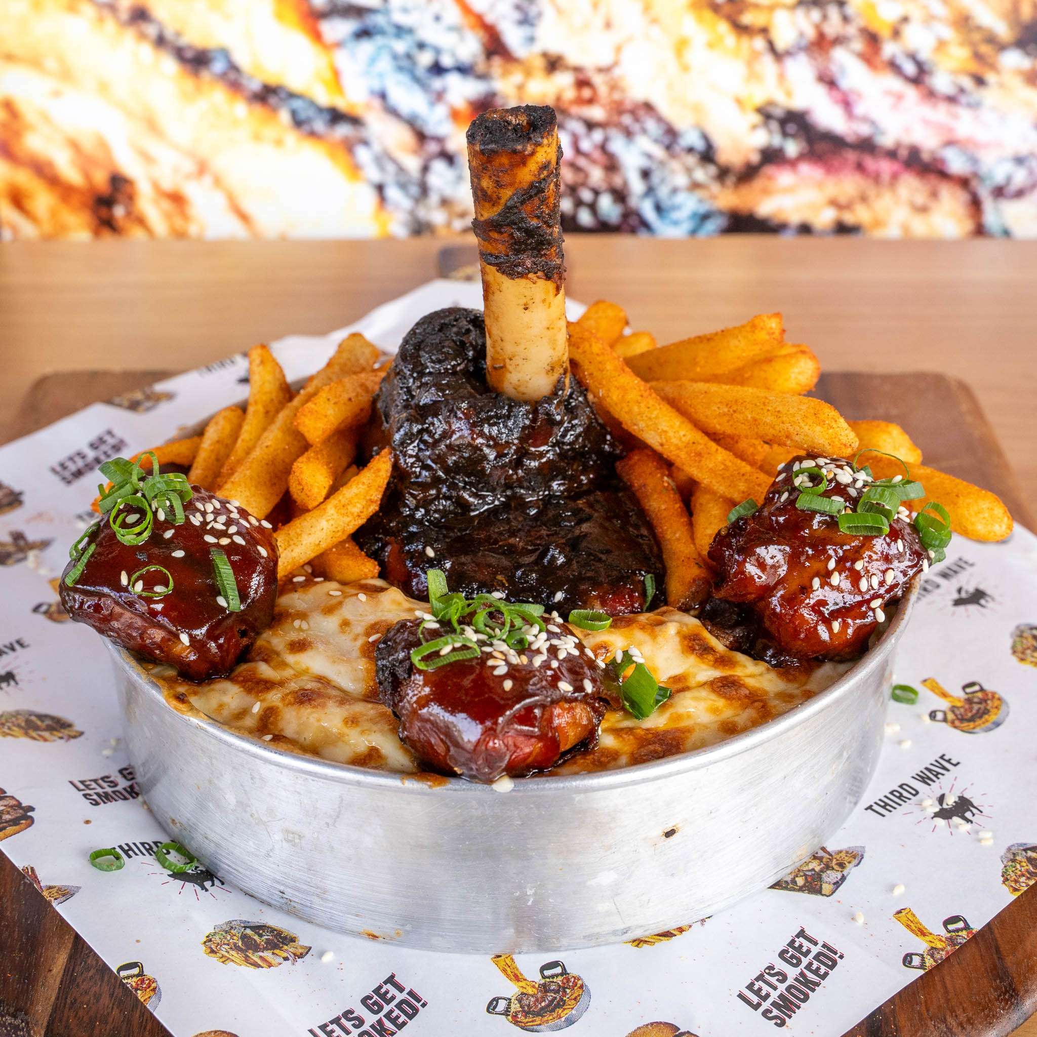 Mini Thor's Hammer with fries, glazed rib bites and flatbread in a tin