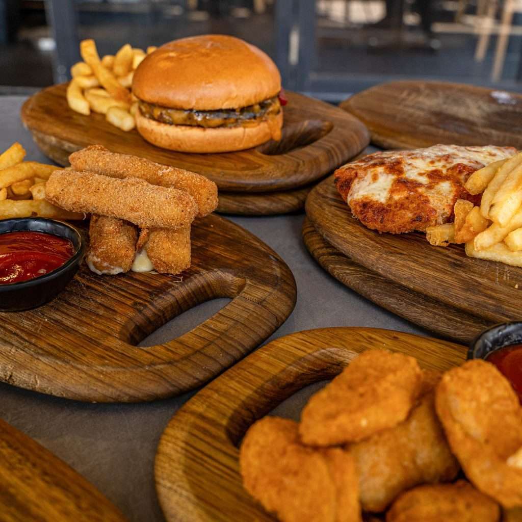 Burger, schnitzel and chips spread for a lunch deal