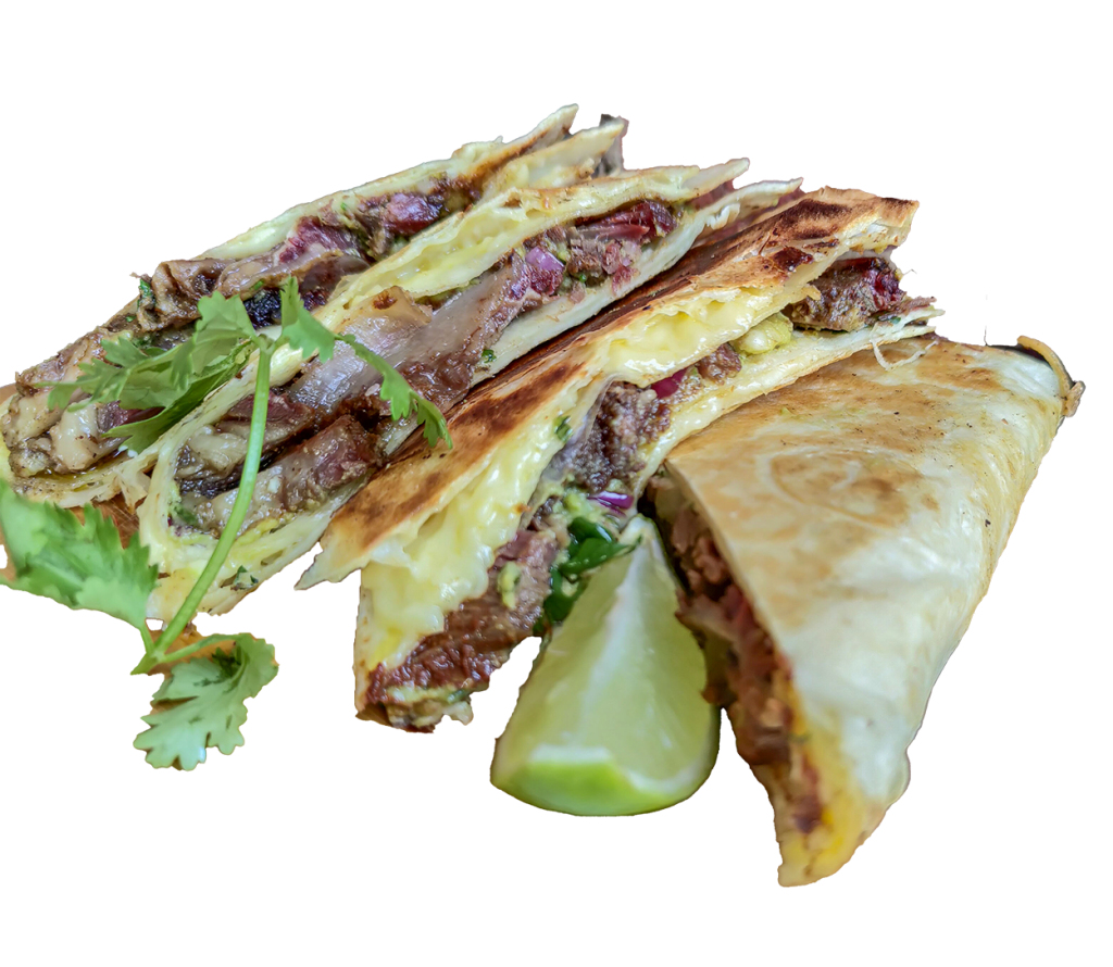 Beef short rib quesadilla wedges with melted cheese and lime