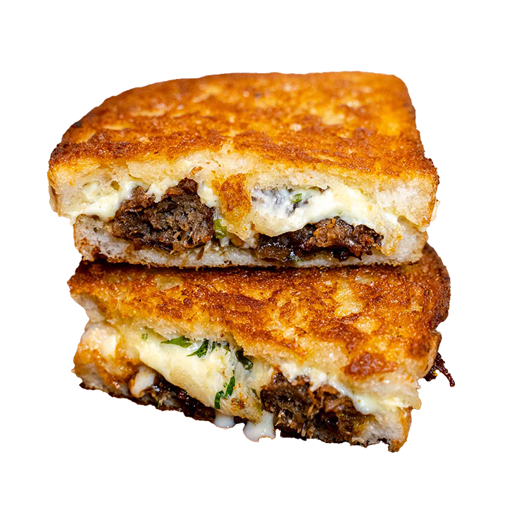 The Fabletarian vegetarian toastie, halves stacked with melted cheese