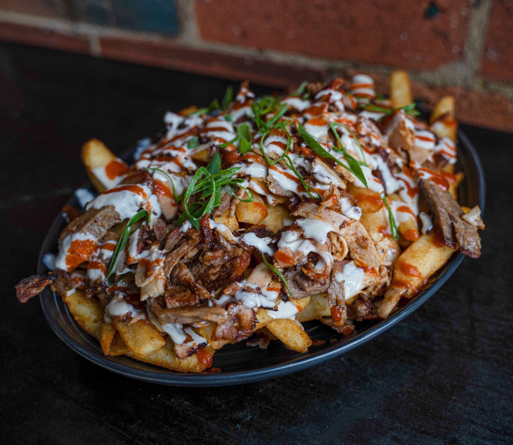 Mixed HSP loaded chips topped with meat, garlic and chilli sauce
