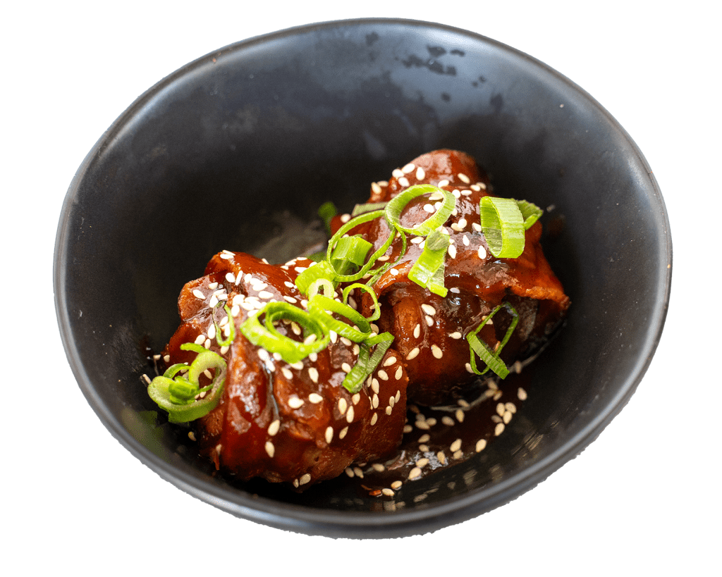 Oink Balls pork bites glazed and topped with spring onion and sesame seeds