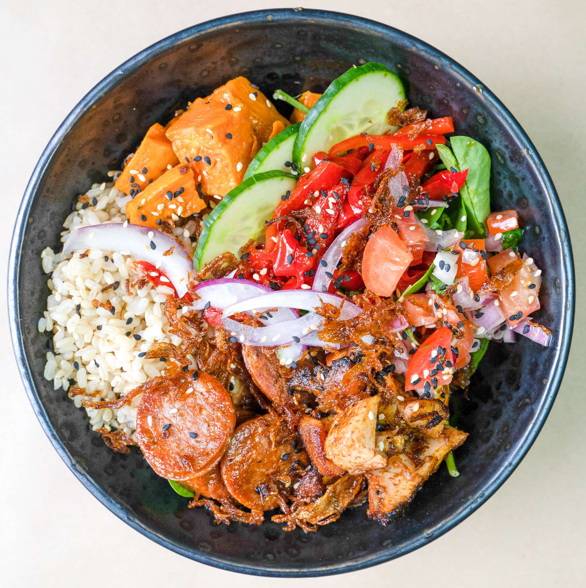 Spanish bowl with chorizo, rice, capsicum and cucumber
