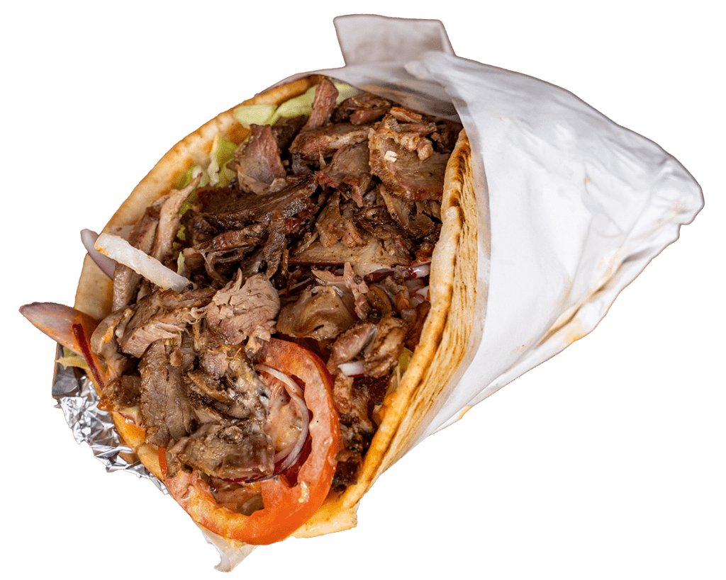Beef kebab wrap with sliced meat and tomato in foil