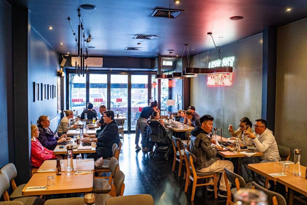 Dining room interior near the entrance at Third Wave BBQ Albert Park