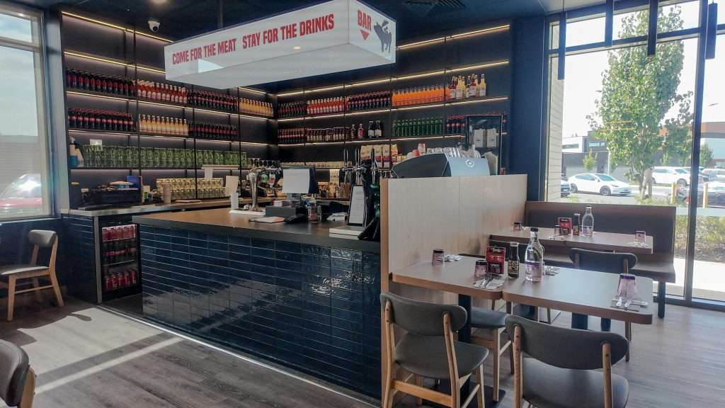 Bar counter and dining tables at Third Wave BBQ Officer