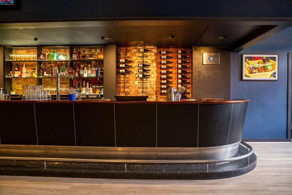 Bar counter with wine shelving at Third Wave BBQ Hawthorn East