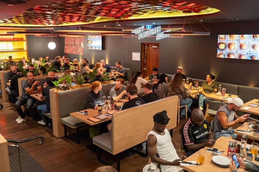 Guests seated in the dining room at Third Wave BBQ Applecross