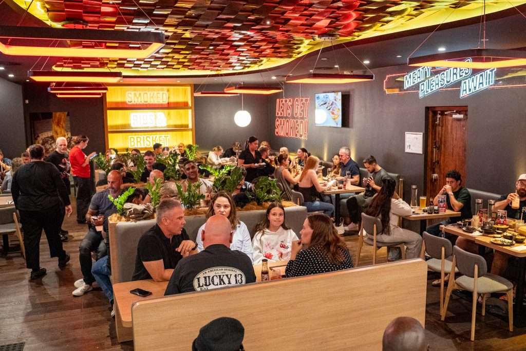 Full dining room with guests at Third Wave BBQ Applecross