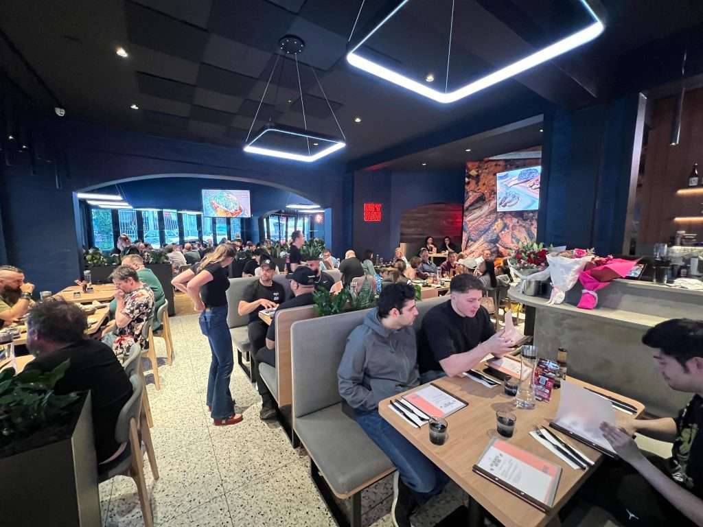 Guests seated in booths at Third Wave BBQ Ascot Vale