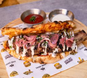 48-hour BBQ pizza pocket with pickled onion and dipping sauces