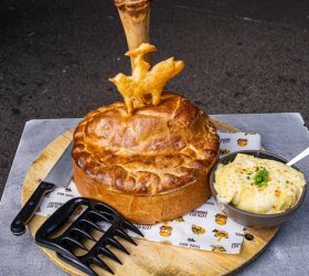 Beef rib pot pie with a bone crust topper, served with mashed potato