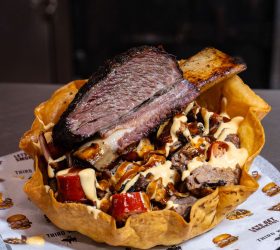 Meat Salad in a crispy tortilla bowl with brisket and sauce