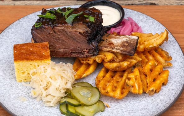 Brisket burnt ends with white sauce, cornbread and waffle fries