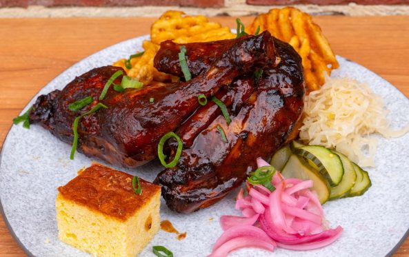 Glazed rib rack with cornbread, waffle fries and sauerkraut