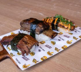 Two pieces of BBQ Nigiri with meat wrapped in nori over rice