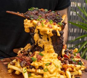 Porkano smoked pork shank on loaded mac and cheese fries