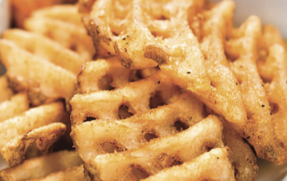 Close-up of crispy golden waffle fries