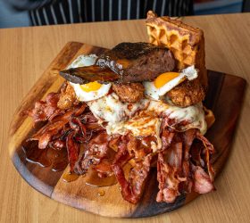Third Wave Chicken and Waffles with bacon, brisket and fried eggs