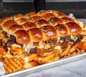 The Slab slider tray over loaded fries and onion rings