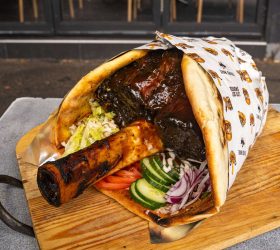 Thor's Hammer Kebab wrap opened to show pulled beef, onion and cucumber