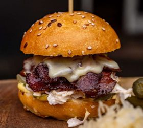 Wagyu Pastrami Slider with melted cheese and coleslaw on a sesame bun