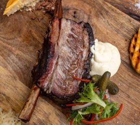 Wagyu Beef Rib on a board with mash, coleslaw and pickle