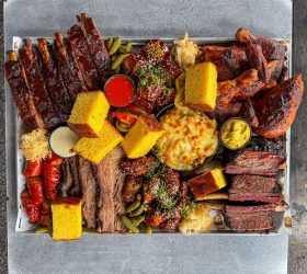 Meat Coma Platter with ribs, brisket, corn and mac and cheese