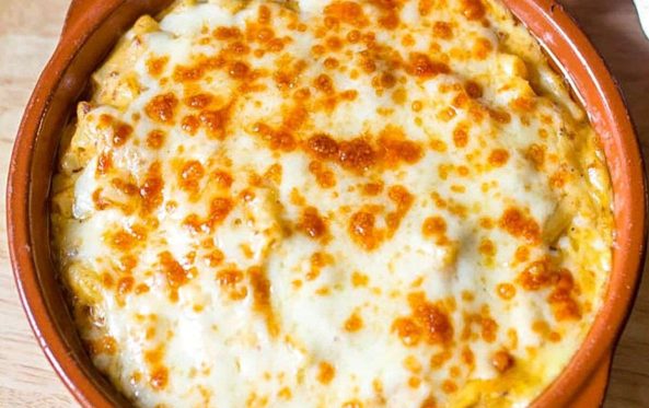 Baked mac and cheese in a terracotta dish