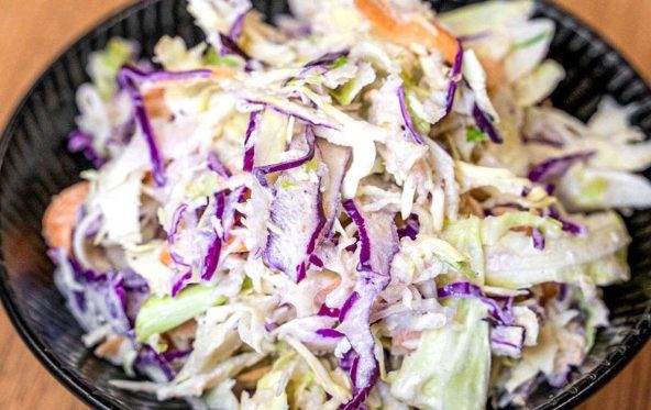 Bowl of coleslaw with red cabbage and carrot