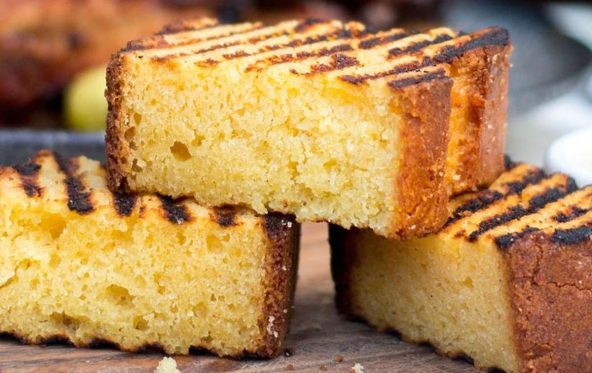 Grilled cornbread slices with charred grill marks