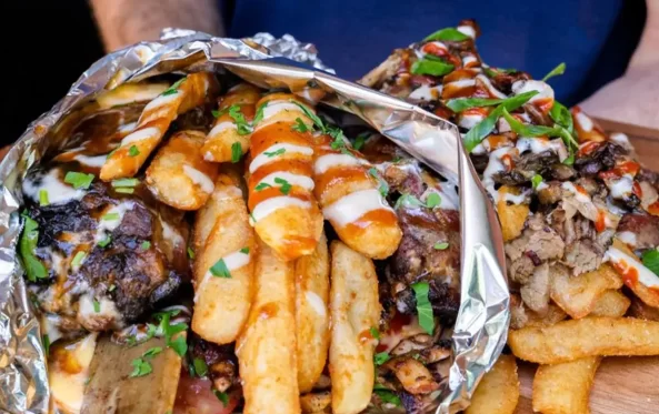 Ribovlaki rib wrap unwrapped with fries in a foil parcel