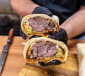 El Shanko Grande burrito halves showing a meat and sauce filling