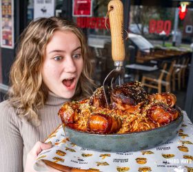 Guest reacting to the Ultimate Smoked Spag Bol with a fork planted in it