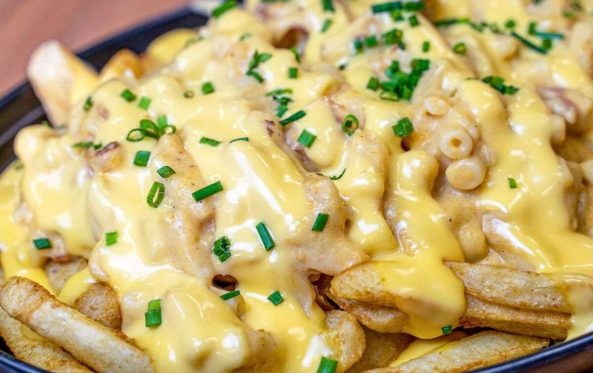 Fries loaded with cheese sauce and chives