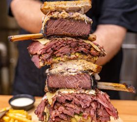 Reuben on Steroids sandwich stacked high with corned beef