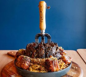 Ultimate Smoked Spag Bol with a giant fork planted in the smoked hock centrepiece
