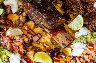 Triple beef nachos loaded with brisket, guacamole and lime